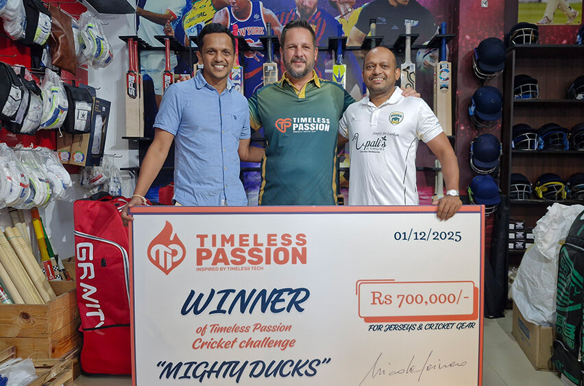 Nicola Cainero, COO of Timeless Tech, presenting the Timeless Passion Cricket Challenge prize to the winning team “Mighty Ducks” in Sri Lanka, holding a ceremonial cheque worth 700,000 LKR for jerseys and cricket gear.